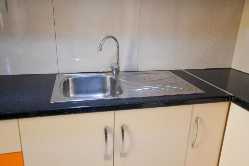 Η κουζίνα ή μικρή κουζίνα στο Apartment Rivaaa