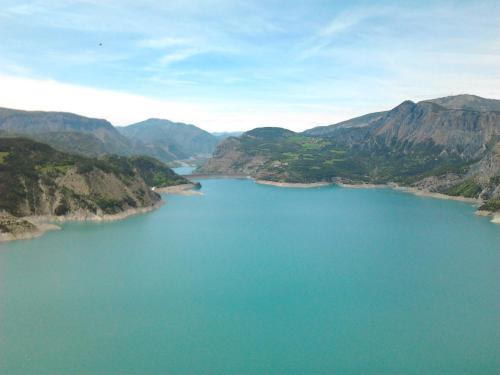 an aerial view of a lake in the mountains at Le Chalet Pastorale Pied Des Pistes in Les Orres