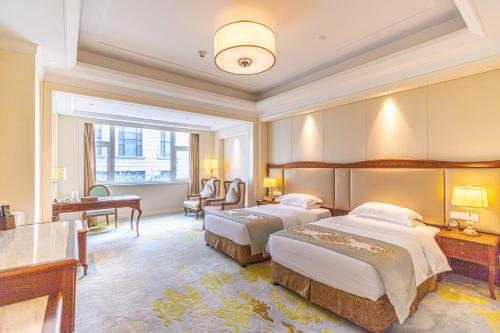 Voodi või voodid majutusasutuse Nanjing Dongjiao State Guesthouse toas