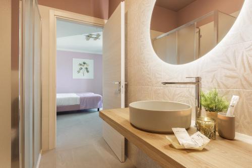 a bathroom with a sink and a mirror at Casale Auriga - Oltrepo' Pavese in Codevilla