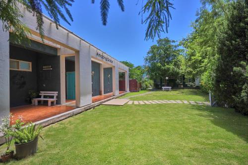 a building with a lawn in front of it at OwlStay Green Villa in Pinghe