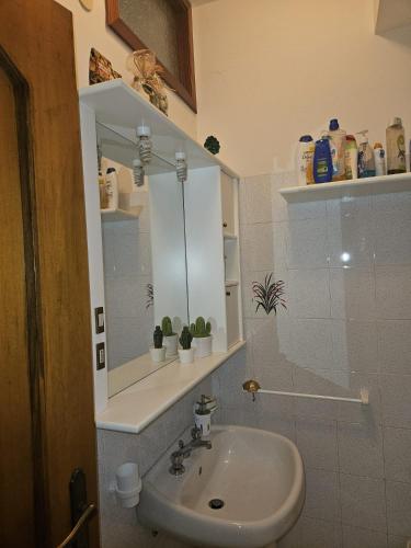 a bathroom with a sink and a mirror at Don Vladi in Letojanni