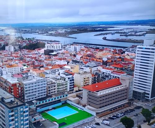 an aerial view of a city with a tennis court at SBT Sun Beach Terrace "The best house" in Figueira da Foz