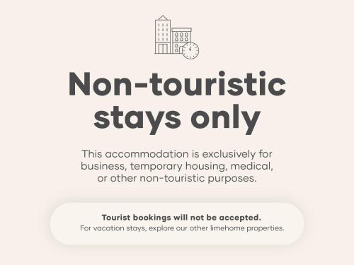 a sign that reads non tourist stays only at Limehome Madrid Calle de Santa Ana - estancia temporal in Madrid