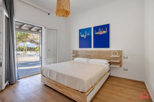 Ένα ή περισσότερα κρεβάτια σε δωμάτιο στο Villa con piscina e SPA sul mare