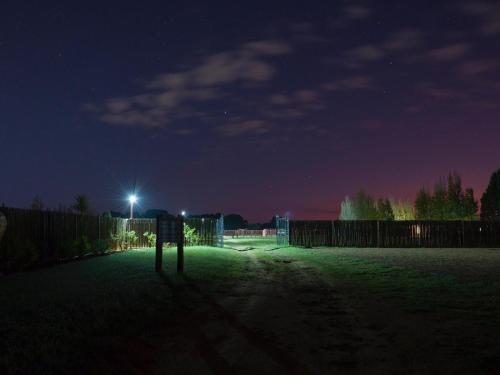 a field at night with a light in the grass at In die Veld Guest Rooms in Bloemfontein