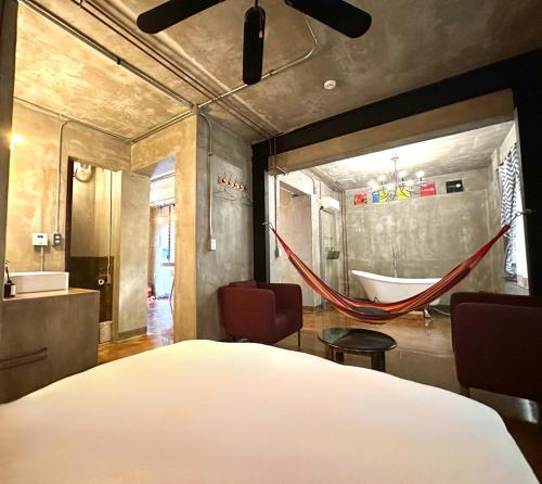 a bedroom with a bed and a hammock in it at TwoTwo House in Seoul