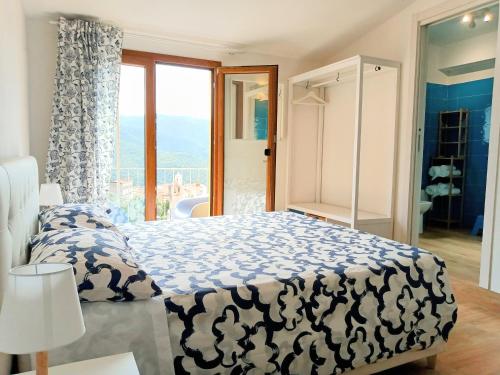 a bedroom with a large bed and a bathroom at La Grotta Sardegna 4 Bedrooms in Urzulei