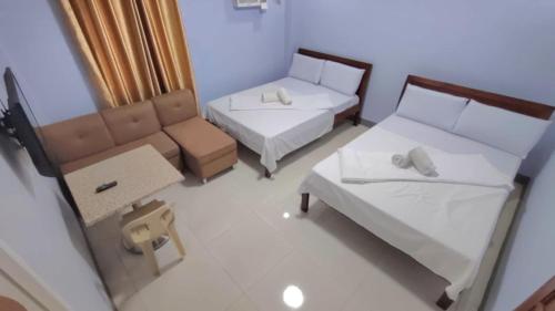 Ένα ή περισσότερα κρεβάτια σε δωμάτιο στο Samara's Guests House