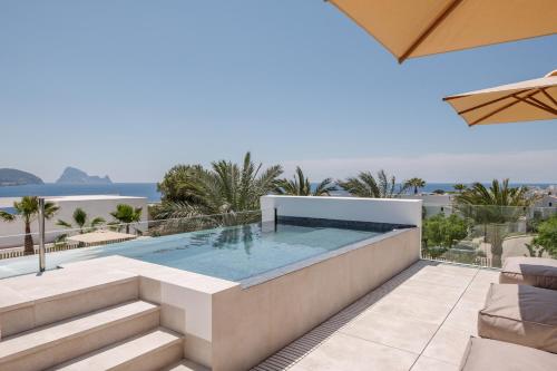 a swimming pool on the roof of a house at 7Pines Resort Ibiza, part of Destination by Hyatt in San Jose