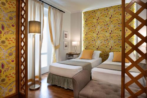 Katil atau katil-katil dalam bilik di Butterfly with Beach & Breakfast included
