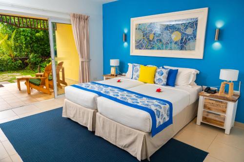 Postel nebo postele na pokoji v ubytování Acajou Beach Resort