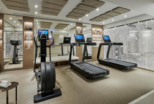 a gym with cardio equipment in a hotel room at La Réserve de Beaulieu in Beaulieu-sur-Mer