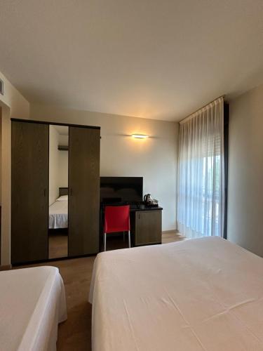 Hotel Parigi 2 & Spaにあるベッド