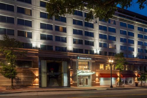 an exterior view of a building at night at Embassy Suites by Hilton Washington DC Chevy Chase Pavilion in Washington