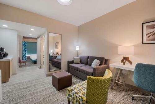 a living room with a couch and a chair at Hilton Garden Inn Oklahoma City Midtown in Oklahoma City