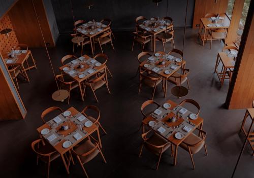 an overhead view of a dining room with tables and chairs at The Valle by Kondody Hotels in Munnar