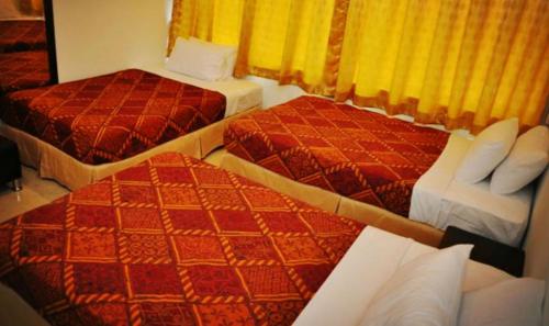 Katil atau katil-katil dalam bilik di Old Budget Hotel