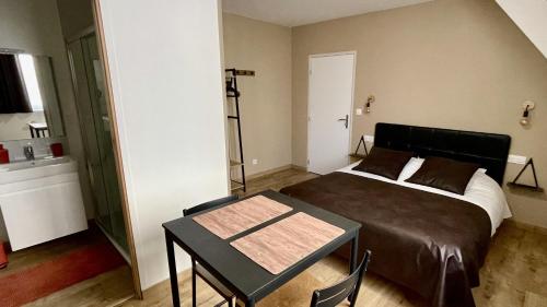 Postel nebo postele na pokoji v ubytování Appart Hotel Gambetta