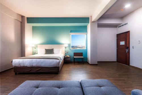 Ένα ή περισσότερα κρεβάτια σε δωμάτιο στο Comfort Inn & Suites Los Cabos