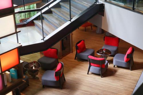 an overhead view of a waiting room with chairs and stairs at Park Plaza Bangkok Soi 18 in Bangkok