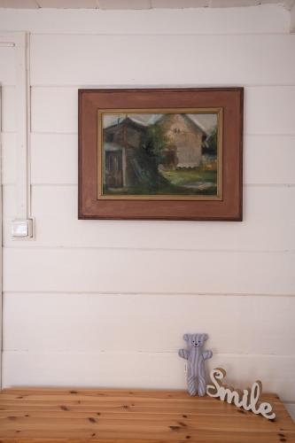 a painting of a painting of a house on a wall at Penzion Statek u Rajtrů in Bedřichov