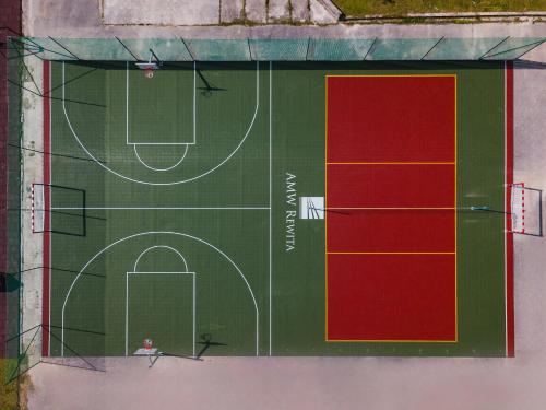 a court with a soccer field on it at Rewita Kościelisko-Zakopane in Kościelisko