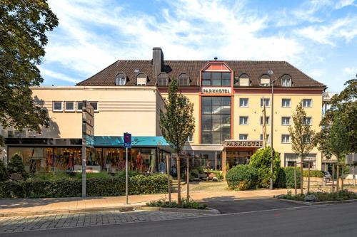 a building on the corner of a street at Parkhotel Crombach in Rosenheim