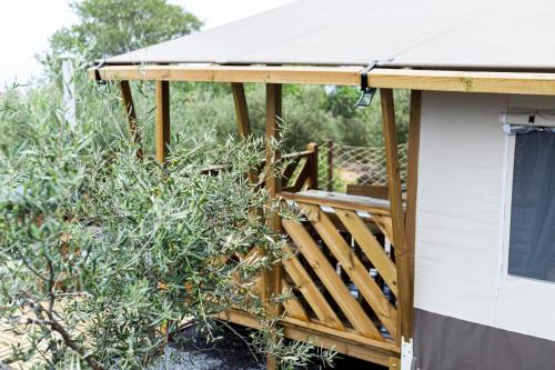 a porch of a rv with a wooden deck at Koru - Etna Glamping Experience in Ragalna