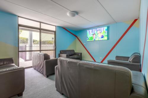 a waiting room with chairs and a tv on a wall at BIG4 Tasman Holiday Parks - Ballina in Lennox Head