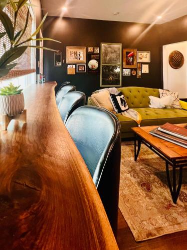 a living room with a couch and a table at Drifterland Artistic Retreat in Lawrenceville in Pittsburgh
