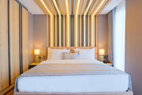 Ένα ή περισσότερα κρεβάτια σε δωμάτιο στο Maritimo Hotel
