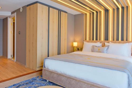 Ένα ή περισσότερα κρεβάτια σε δωμάτιο στο Maritimo Hotel