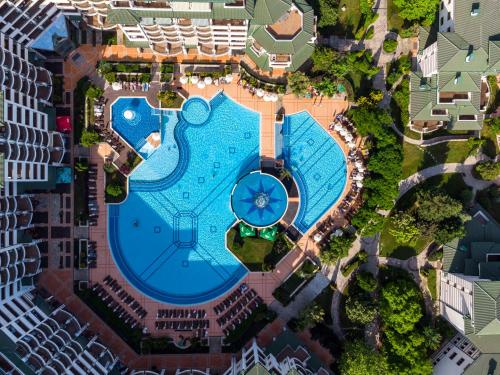 an overhead view of a swimming pool in a city at Emerald Beach Resort & Spa in Ravda