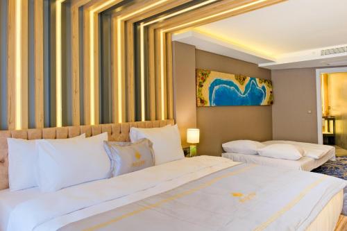 Ένα ή περισσότερα κρεβάτια σε δωμάτιο στο Maritimo Hotel