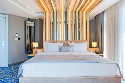Ένα ή περισσότερα κρεβάτια σε δωμάτιο στο Maritimo Hotel