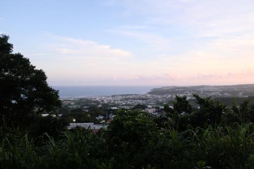 a view of the ocean from a hill at momo in Kirabaru