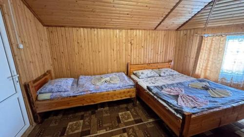Postel nebo postele na pokoji v ubytování Ялинка