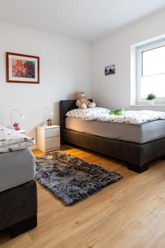 Ένα ή περισσότερα κρεβάτια σε δωμάτιο στο Ferienhaus Wiesenblume