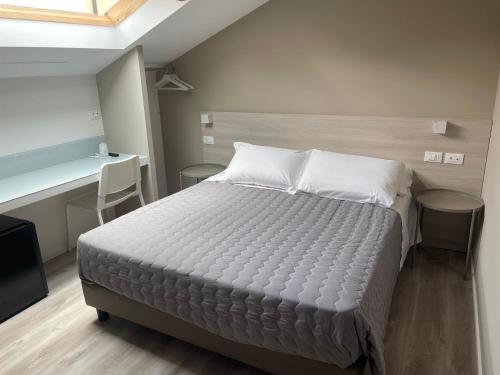 Postel nebo postele na pokoji v ubytování Hotel Principe