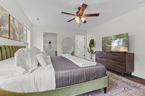 a bedroom with a bed and a ceiling fan at Edgewood - Work Friendly & Near Downtown in Jeffersonville