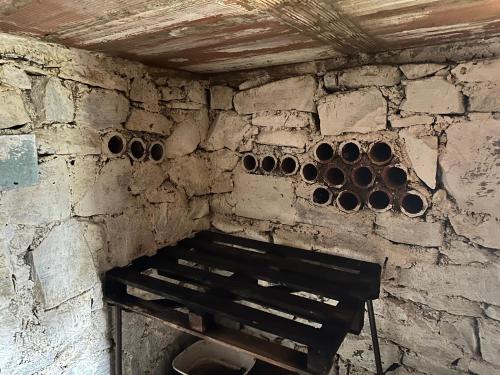 a corner of a room with a wall witholithicolithicolithicolithicolithicolithicolithic at Chalupa Jarka in Jablŭnka