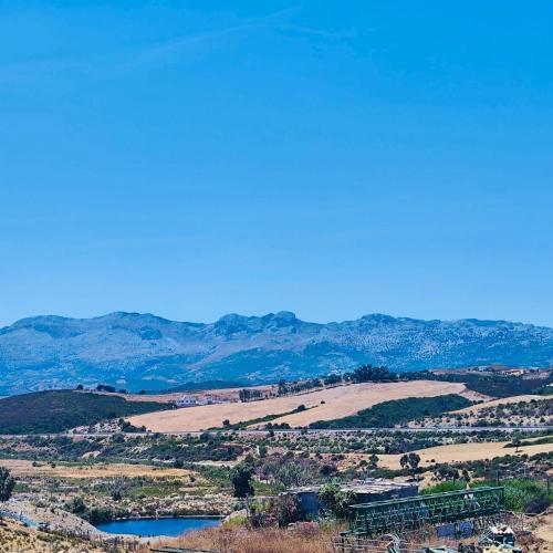 a view of a valley with a lake and mountains at Colina Smir Resort Marina Smir, Tamuda Bay Kabila Beach, M'diq in Sania Torres