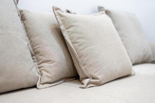 a group of pillows sitting on a couch at 1 BR Condo Chapelas Costa del Silencio AC Pool WIFI in Arona