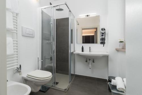 a bathroom with a shower and a toilet and a sink at Residence Al Frantoio in Arco