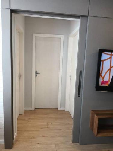 TV a/nebo společenská místnost v ubytování Apartamento Cidade das Flores