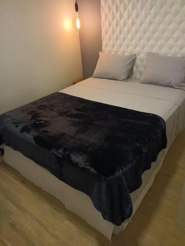 Postel nebo postele na pokoji v ubytování Apartamento Cidade das Flores