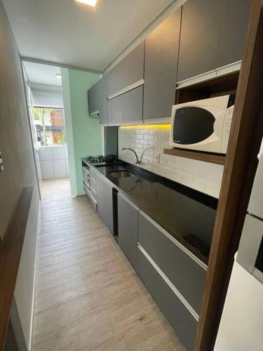 Kuchyň nebo kuchyňský kout v ubytování Apartamento Cidade das Flores