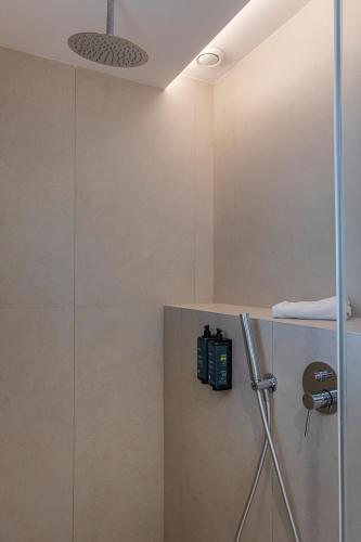 a bathroom with a shower with a glass door at Bordoy Cosmopolitan in Playa de Palma