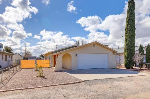 a house with a garage in a driveway at Kingman Vacation Rental with Yard and Fire Pit in Kingman
